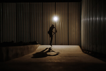 Canvas Print - Closeup shot of a skateboarder silhouette in the action of jumping