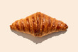 © Gemma Ferrando/Westend61 - Freshly baked butter croissant on biege background