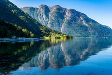 Mountain Reflecting In Clean Water Of Eid Fjord