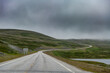 © Michael Runkel/Westend61 - Empty road under overcast sky, Nordkapp, Norway