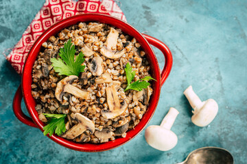 Wall Mural - Buckwheat with mushrooms. Grits platter with fried mushrooms