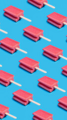 abstract pattern of kitchen sponges with popsicle ice cream sticks on vibrant bright blue background