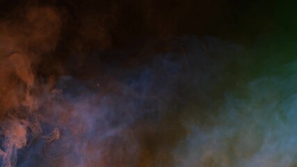 Wall Mural - smoke rising red blue and green background 4k loop features a mix of red, blue, and green smoke risi