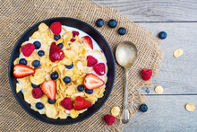 Corn Flakes With Milk, Blueberries, Strawberries And Raspberries