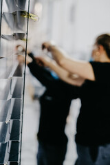 Canvas Print - Worker assembling Venetian blinds in a factory