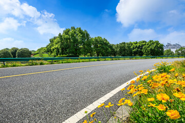 Asphalt road and green forest natural scenery.Highways and natural backgrounds.