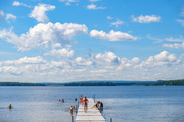 Sticker - Jetty with bathing children in a lake