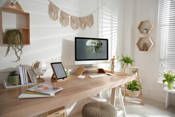 Stylish home office interior with comfortable workplace