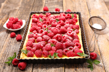 Poster - raspberry tart with cream on wood background