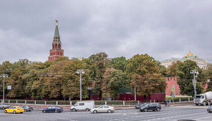  Along the streets moving pedestrians and vehicles