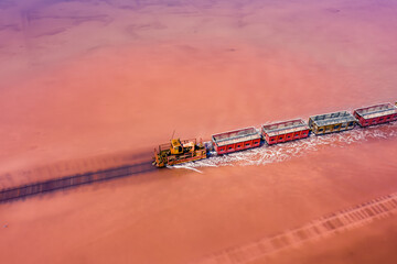 Sticker - Aerial view of a lake train in the crimson salt lake, Altai