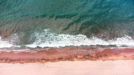  Beautiful aerial top down landscape to a beach with crashing waves