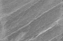 Black And White Background. Gray Rock Texture. Grunge Stone Background. The Texture Of The Mountains. Close-up. Grunge Banner With Volumetric Rock Texture