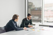 © Johnér - Coworkers talking in board room