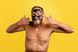 © ADDICTIVE STOCK - Cheerful shirtless man with clay mask on face