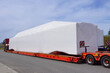 Very long vehicle. Oversize load or exceptional convoy. A truck with a special semi-trailer for transporting oversized loads.