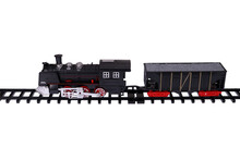 A Steam Locomotive And A Car On The Rails. Toy Train On A White Background, Isolated Image