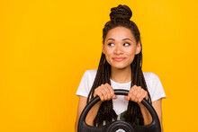 Photo Of Dreamy Happy Afro American Young Woman Look Empty Space Drive Car Isolated On Yellow Color Background