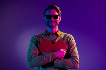 Poster - Photo of young man happy positive smile hug paper heart feelings romantic isolated over neon color background