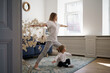 © diignat - Young mother with little daughter practicing yoga at home. Family fizical activity, sporty mom and kid