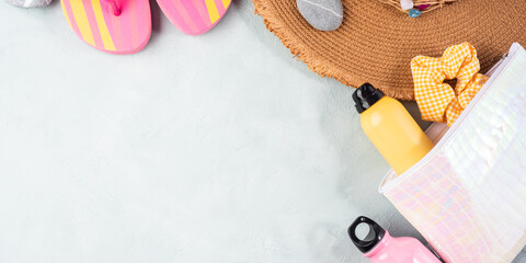 Canvas Print - Summer sea vacation accessories. Straw hat, flip flops, sun spray, sunglasses on stone background.