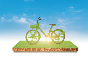 green bicycle driving green grass field over blue sky background. environment and ecology concept