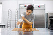 © Anischenko - Pastry chef girl prepares fresh cakes at her small production facility
