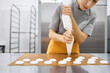 © Anischenko - Pastry chef girl prepares fresh cakes at her small production facility