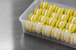 © Anischenko - Yellow cakes are neatly stacked in a box