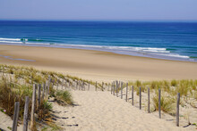 Beach Sea With Sand Dunes And Sandy Fence Access On Atlantic Ocean In Gironde France Southwest