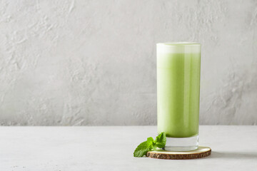 Green smoothie mint or matcha latte in tall glass