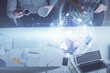 © peshkova - Double exposure of man and woman working together and social network theme hologram drawing. Computer background. connecting concept. Top View.