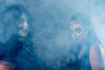 Supernatural entities, portrait of two supernatural entities, artistic makeup, black background, Low Key portrait, selective focus.