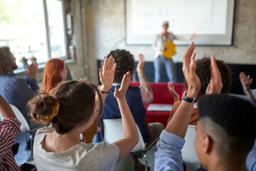 Wall Mural - A group of young creative people are congratulating on an interesting presentation at conference room. Employees, office, work