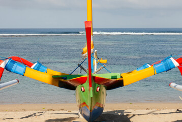 Wall Mural - Brightly painted fishing outriggers on the beach at Sanur, Bali, Indonesia