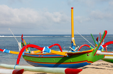 Wall Mural - Brightly painted fishing outriggers on the beach at Sanur, Bali, Indonesia