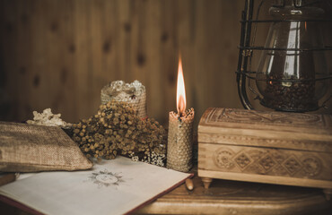 Magical attribute on a table, witchcraft concept, Candle fire, Spells and other rituals