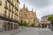 View at the Plaza Mayor and front view at the iconic spanish gothic building at the Segovia cathedral, towers and domes, downtown city