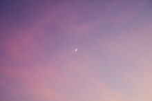 The Waxing Moon In A Pink Sky After Sunset
