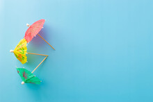 Summer Theme Background With Three Cocktail Umbrellas