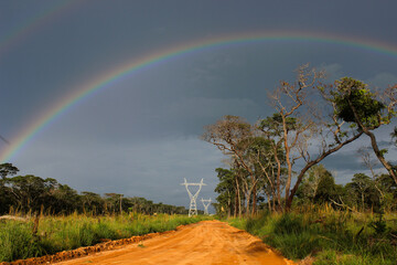 Rainbow over Power Transmission Line Wild Zambia Africa