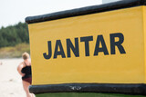 Fototapeta Londyn - Inscription 'Jantar' on the wooden fishing boat, Poland.