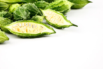 Wall Mural - Balsam apple, Bitter cucumber, Bitter gourd, Balsam pear (momordica charantia) isolated on white background.