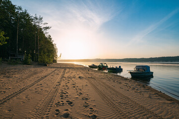 Wall Mural - Morning landscape, sunrise over the river, sandy beach near the shore are boats.