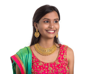 Beautiful Indian traditional girl posing on white background.