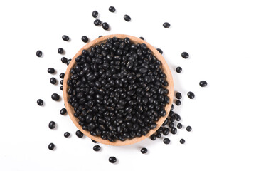 raw black soya bean in a bowl isolated on white background.