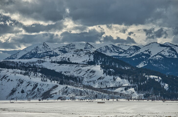 Sticker - Majestic snowy mountain range on background of the cloudy sky