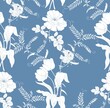 White silhouettes of flowers on a blue background. Seamless vector pattern.