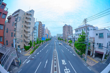 A traffic jam at the avenue daytime in the downtown fish eye shot