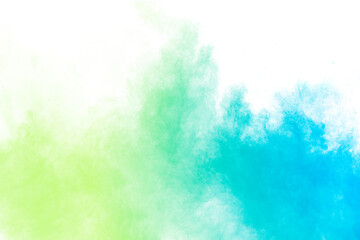 Wall Mural - abstract blue green powder explosion on white background.freeze motion of blue green dust cloud.